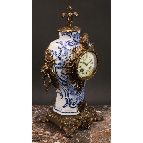 1558 - A late 19th/early 20th century French brass mounted Delftware mantel clock, 8.5cm circular dial insc... 