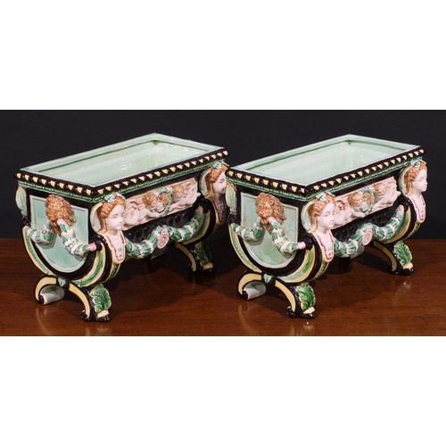 13 - A pair of Aesthetic Movement period majolica table jardinieres, in the manner of Minton, in bold rel... 