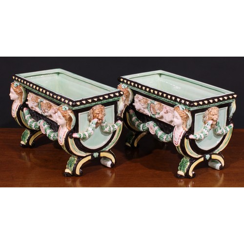 13 - A pair of Aesthetic Movement period majolica table jardinieres, in the manner of Minton, in bold rel... 