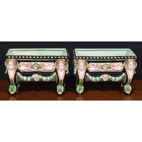 13 - A pair of Aesthetic Movement period majolica table jardinieres, in the manner of Minton, in bold rel... 