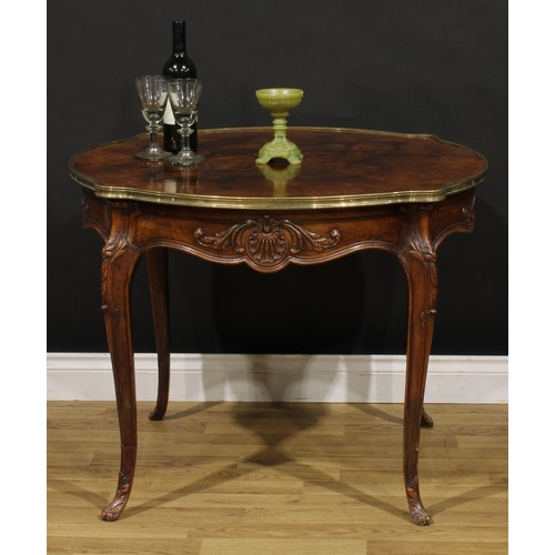 1202 - A Louis XV Revival brass mounted walnut shaped circular centre table, quarter-veneered top, shaped f... 