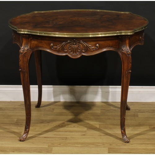 1202 - A Louis XV Revival brass mounted walnut shaped circular centre table, quarter-veneered top, shaped f... 