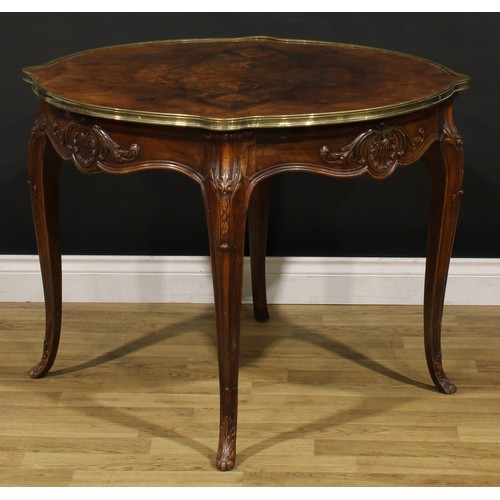 1202 - A Louis XV Revival brass mounted walnut shaped circular centre table, quarter-veneered top, shaped f... 