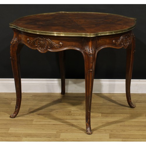 1202 - A Louis XV Revival brass mounted walnut shaped circular centre table, quarter-veneered top, shaped f... 