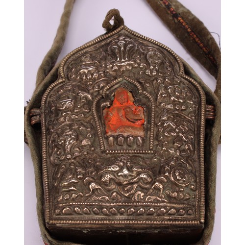 257 - A Tibetan silver coloured metal and copper Buddhist gau box, typically embossed and of lotus form, 1... 