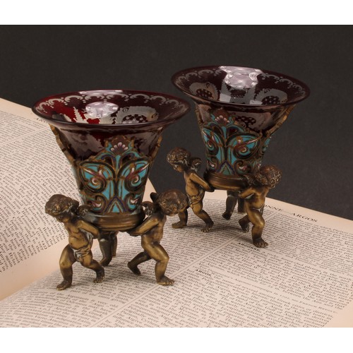 1239 - A pair of French patinated bronze and champleve enamel mantel vases, each with Bohemian glass liner ... 