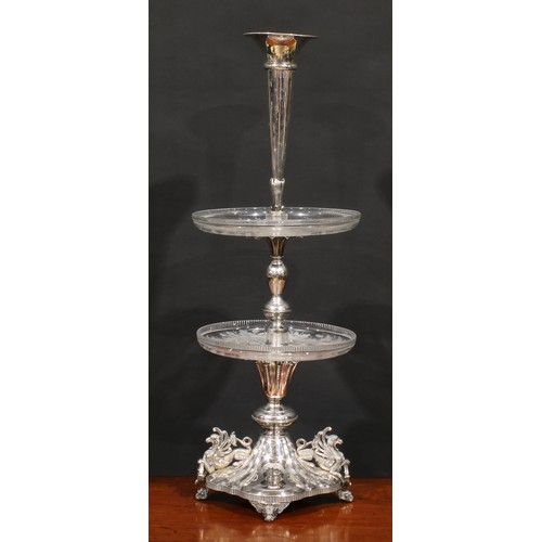 566 - A Victorian electro-plated table centrepiece, trumpet shaped epergne flute above two glass plateaux ... 