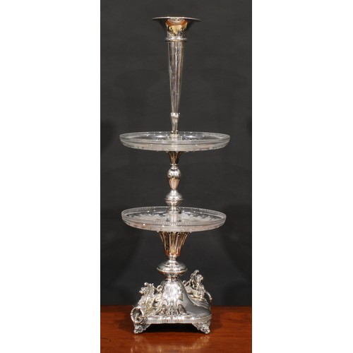 566 - A Victorian electro-plated table centrepiece, trumpet shaped epergne flute above two glass plateaux ... 