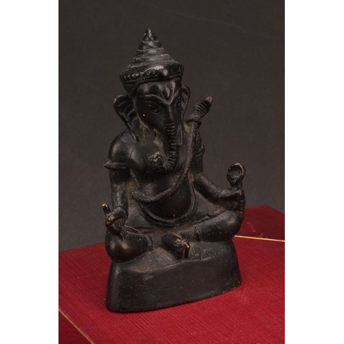 261 - Indian School, a dark patinated bronze, Ganesh, 15cm high