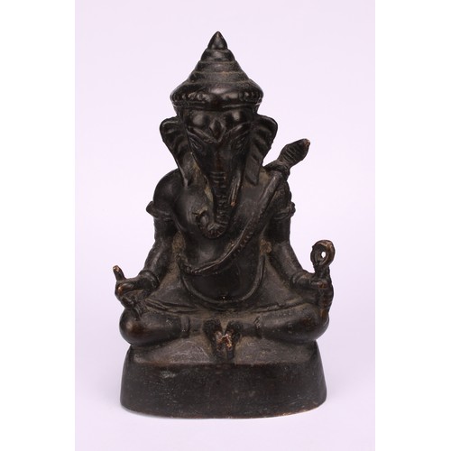 261 - Indian School, a dark patinated bronze, Ganesh, 15cm high