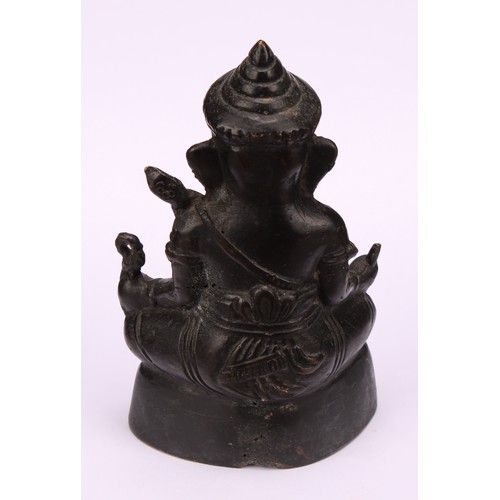 261 - Indian School, a dark patinated bronze, Ganesh, 15cm high