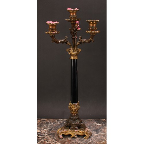 1289 - A pair of 19th century gilt and dark patinated bronze, and black marble four-light table candelabra,... 