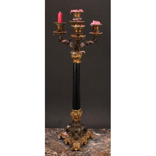 1289 - A pair of 19th century gilt and dark patinated bronze, and black marble four-light table candelabra,... 