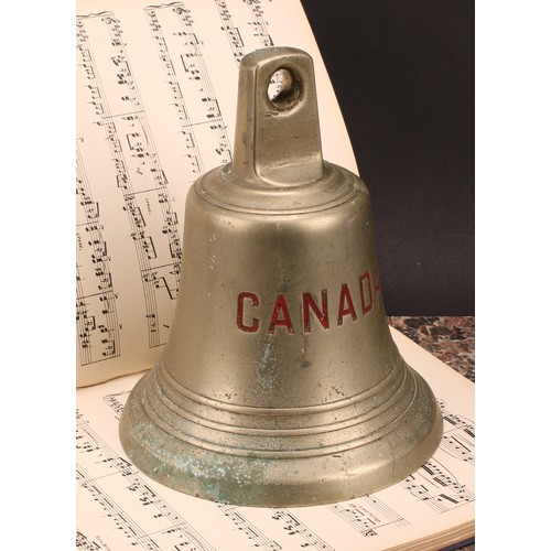 1919 - An early 20th century ship's bell, inscribed in red Canada, 24.5cm high