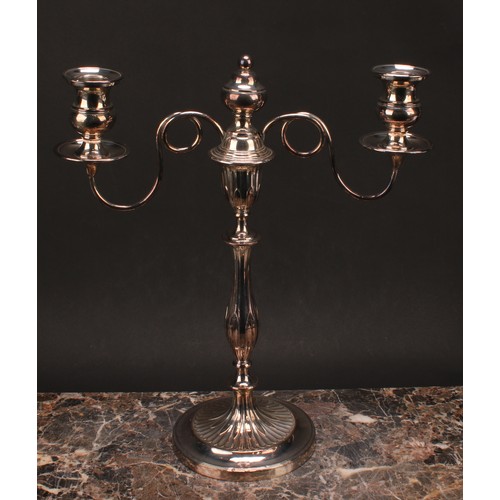 552 - A pair of George III Old Sheffield Plate two-light table candelabra, campana sconces, slender balust... 