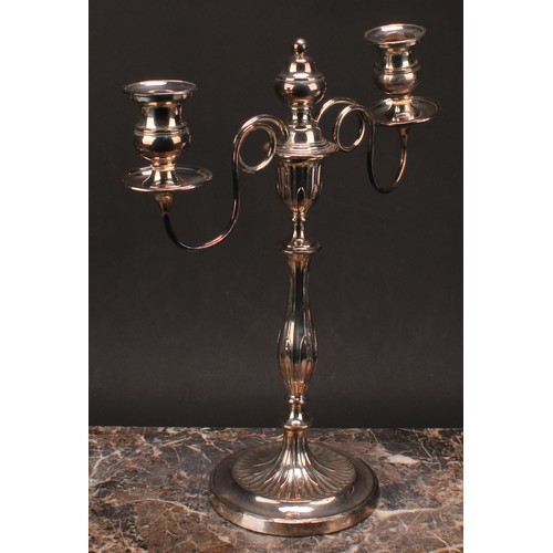 552 - A pair of George III Old Sheffield Plate two-light table candelabra, campana sconces, slender balust... 