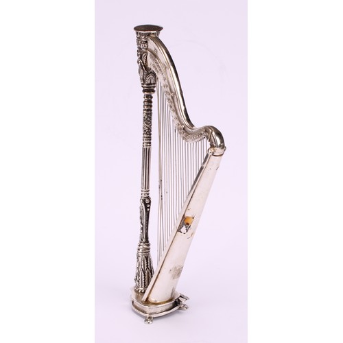 603 - A Continental cast silver miniature model, of a harp, 15.5cm high, import marks for London 1990, 114... 