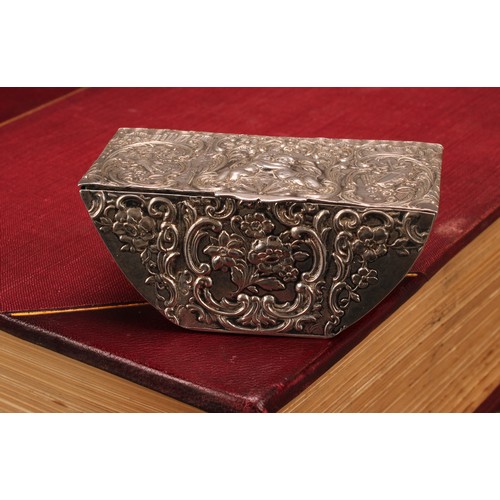 580 - A 19th century Dutch silver boat shaped table snuff box, chased with putti, Bacchic and musical trop... 