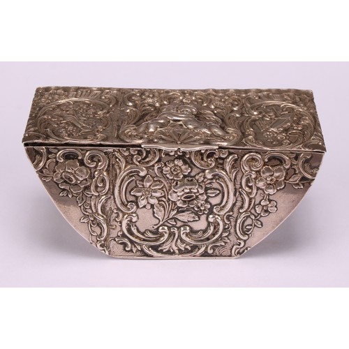 580 - A 19th century Dutch silver boat shaped table snuff box, chased with putti, Bacchic and musical trop... 