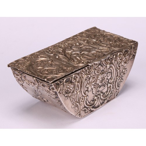 580 - A 19th century Dutch silver boat shaped table snuff box, chased with putti, Bacchic and musical trop... 