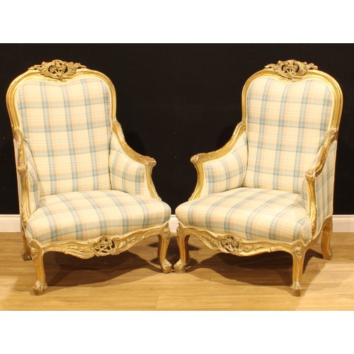 1274 - A pair of Italian giltwood armchairs, in the 18th century Rococo taste, shaped cresting carved with ... 