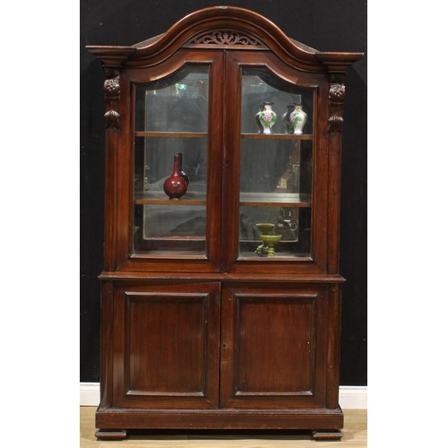 1441 - A Victorian mahogany shop display case or library bookcase, arched cornice above a pair of glazed do... 