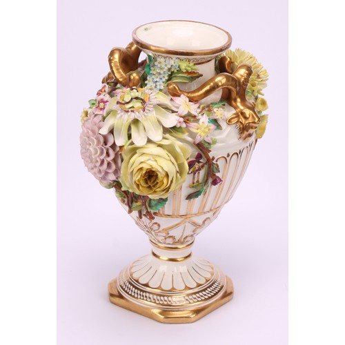 38 - A pair of John Bevington porcelain pedestal vases, of Neo Classical form, encrusted with flowers, gi... 