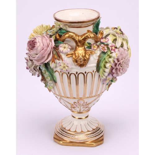 38 - A pair of John Bevington porcelain pedestal vases, of Neo Classical form, encrusted with flowers, gi... 