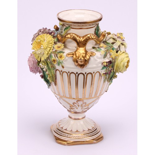 38 - A pair of John Bevington porcelain pedestal vases, of Neo Classical form, encrusted with flowers, gi... 