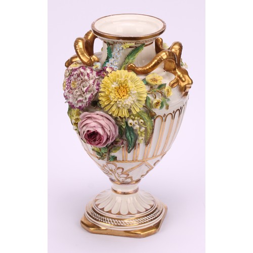 38 - A pair of John Bevington porcelain pedestal vases, of Neo Classical form, encrusted with flowers, gi... 