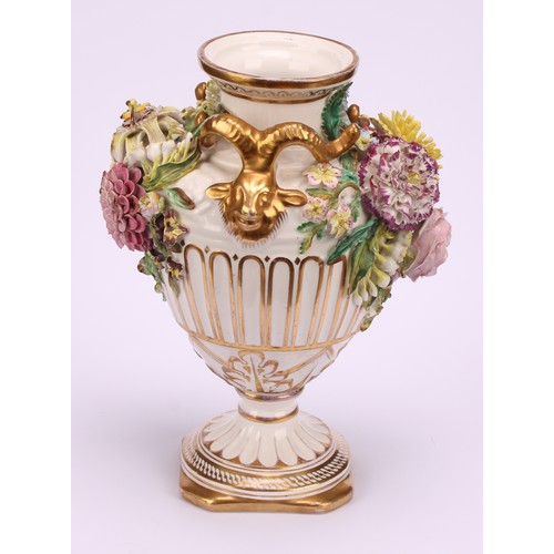 38 - A pair of John Bevington porcelain pedestal vases, of Neo Classical form, encrusted with flowers, gi... 