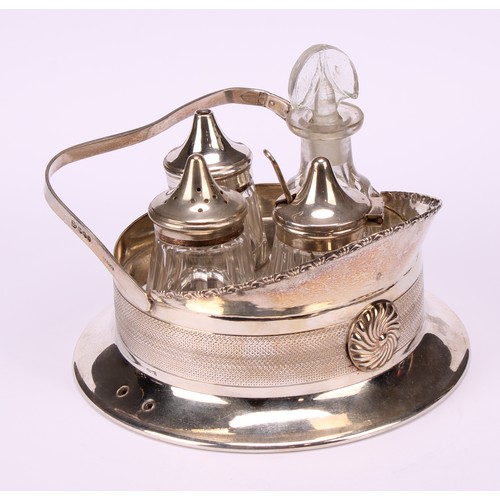 572 - An early 20th century E.P.N.S novelty four-bottle cruet, as an officer's cap, engine turned band, 13... 