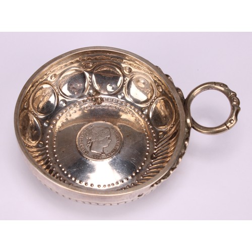 585 - A 19th century French silver wine taster, the chased and fluted bowl set with a Spanish coin, serpen... 