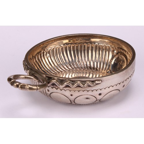 585 - A 19th century French silver wine taster, the chased and fluted bowl set with a Spanish coin, serpen... 