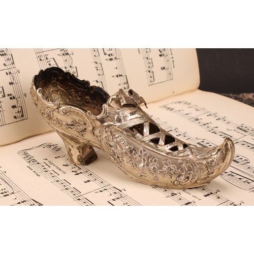 612 - A Dutch silver model, of a shoe, pierced, and chased with flowers and scrolls, on a textured ground,... 