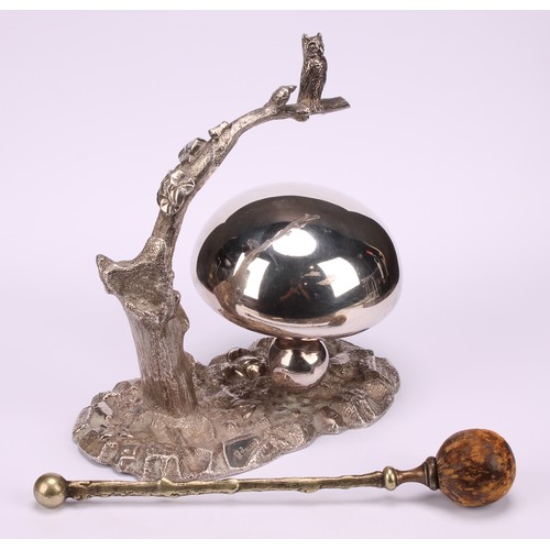 549 - A late Victorian/Edwardian E.P.N.S novelty table top dinner gong, as an owl on a branch, perched abo... 