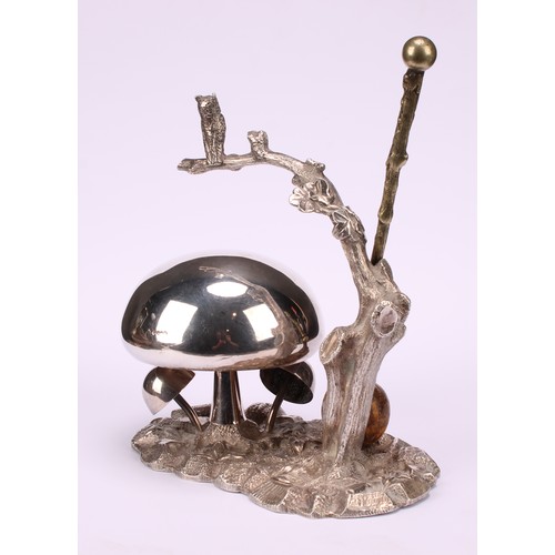 549 - A late Victorian/Edwardian E.P.N.S novelty table top dinner gong, as an owl on a branch, perched abo... 