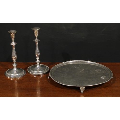 551 - A pair of George III Old Sheffield Plate table candlesticks, bell shaped sconces, slender baluster p... 