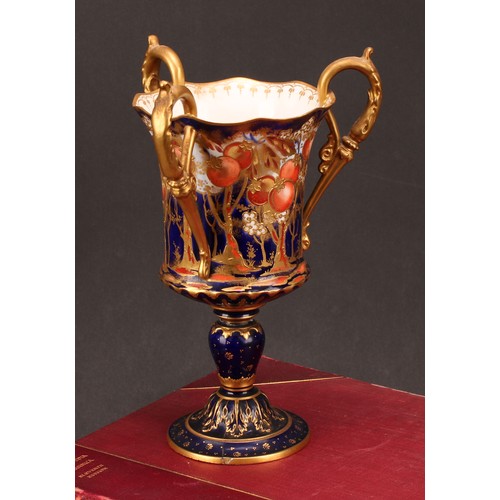 119 - A Royal Crown Derby Imari three handled pedestal vase, in the Art Nouveau manner, decorated with fru... 