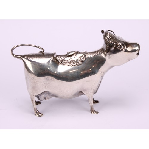 651 - A George III style silver cow creamer, in the manner of John Schuppe, hinged cover, 15cm long, Willi... 