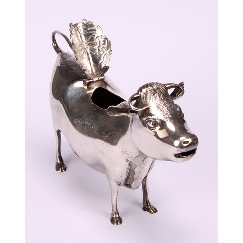 651 - A George III style silver cow creamer, in the manner of John Schuppe, hinged cover, 15cm long, Willi... 