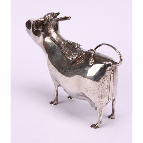 651 - A George III style silver cow creamer, in the manner of John Schuppe, hinged cover, 15cm long, Willi... 