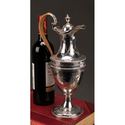 647 - A George III silver urnular pedestal wine jug, hinged domed cover with urnular finial, bright-cut en... 