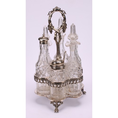 569 - A Victorian silver mounted six bottle cruet, posted leafy vine handle, hexafoil base, lion paw feet,... 