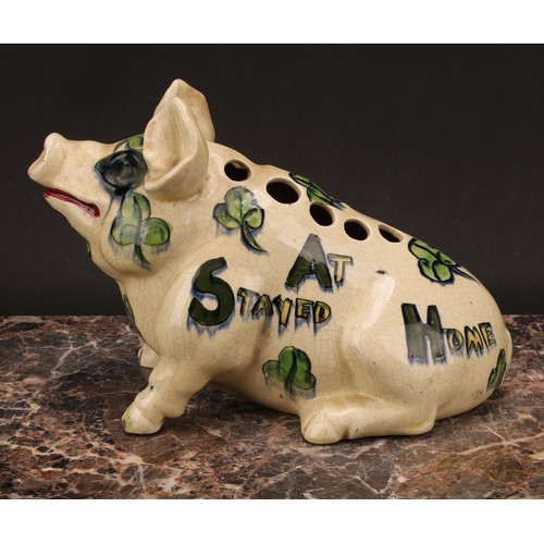 4 - A 19th century English pottery posy vase, modelled as a pig, in the manner of Wemyss, painted in ton... 