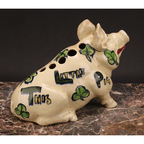 4 - A 19th century English pottery posy vase, modelled as a pig, in the manner of Wemyss, painted in ton... 