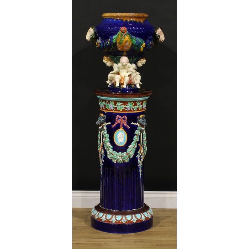 1452 - A Victorian Wedgwood majolica jardiniere pedestal, polychrome decorated and moulded with fruiting vi... 