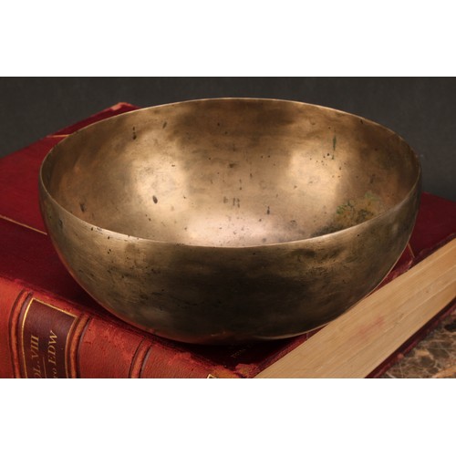 1299 - A Tibetan bronze singing bowl, 19cm diam, 19th century