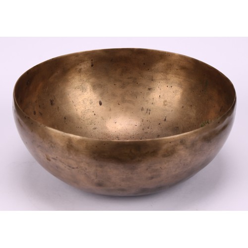 1299 - A Tibetan bronze singing bowl, 19cm diam, 19th century