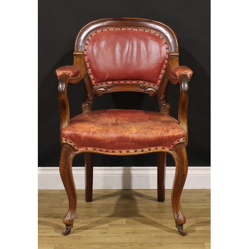 1870 - A Victorian walnut desk chair, cartouche shaped back carved with acanthus, stuffed-over upholstery, ... 